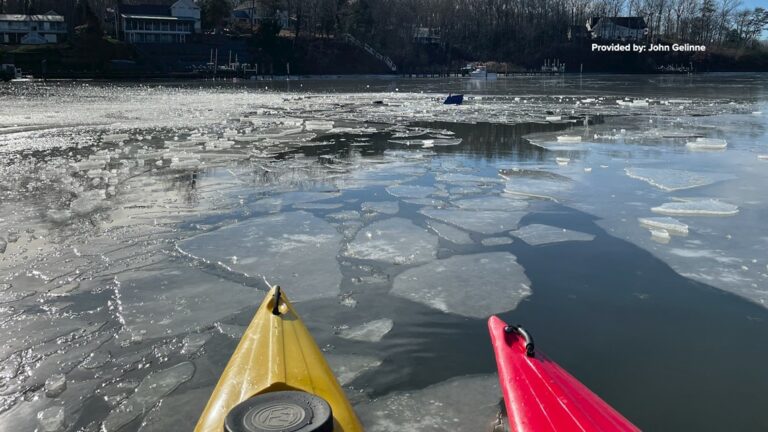 Kayakers save pilot after crash into frozen lake