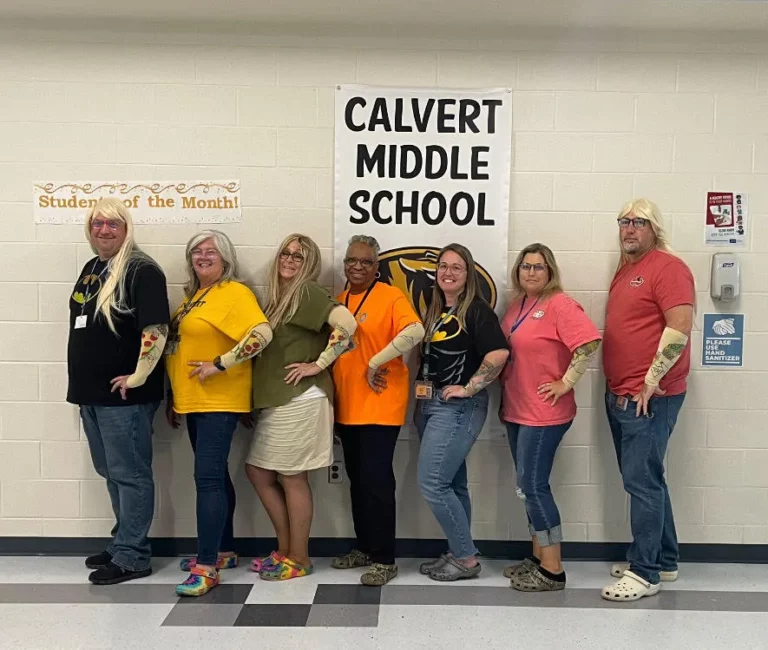 Calvert Middle School Staff Dresses Up As Ms. DeHenzel For Superhero Spirit Day